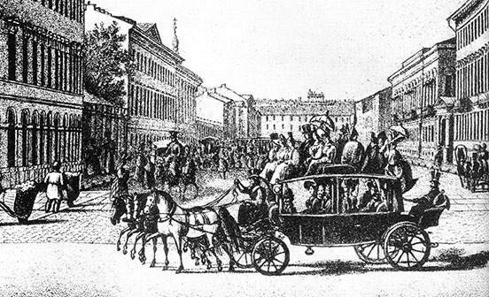 omnibus with four horses in tandem, completely laoded with passengers inside and on top, in from of a square of buildings 