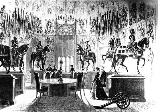 Mannequins of five horses with accoutrements, an empty table and chairs centre; a small cannon front right; people looking at the displays: three in back, a man and woman in early Victorian dress centre mid-field 