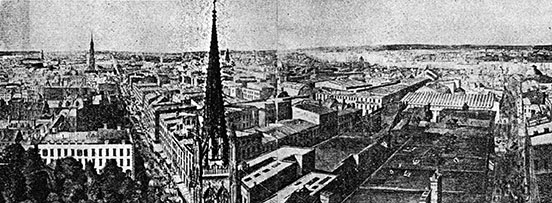 Panorama of a city's roofline, a single church spire in the front centre