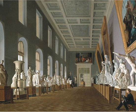 A student sitting drawing in the bottom right; rows of statuary line the right and left sides of the room, with paintings on the right wall and circle-topped windows on the left