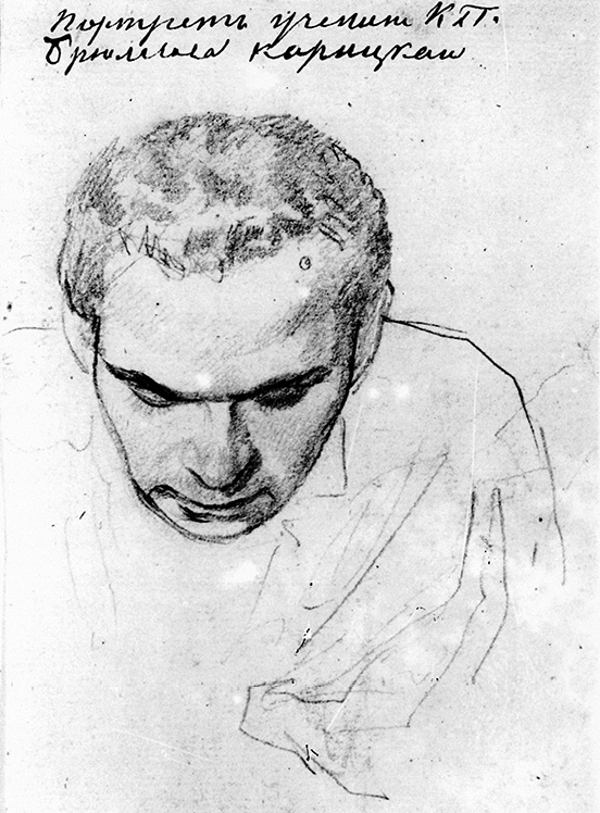 Koritskii is facing down, so his high forehead is prominent, slightly left of centre on the page; mole on left of forehead visible