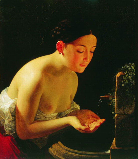 Topless woman leaning over a fountain gathering water in her hands from a spigot