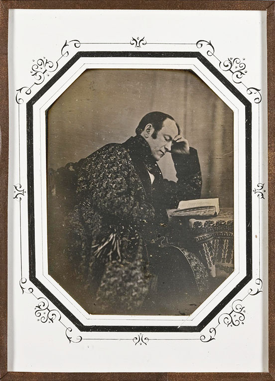 daguerrotype of Count Alexei Alekseevich Bobrinsky sitting at a desk, head bent