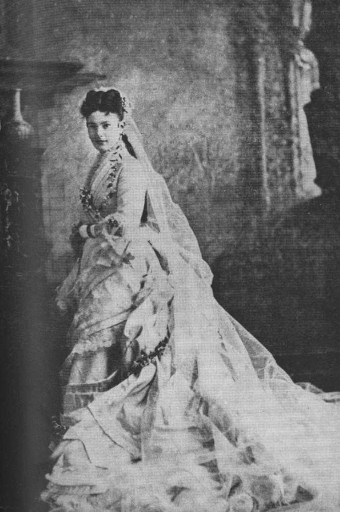 Woman in Victorian wedding dress with full bustle and train